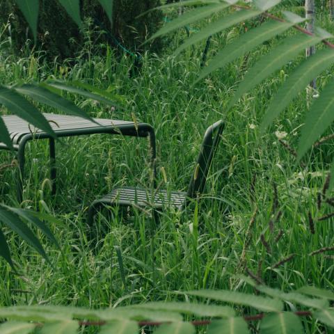 A patio set by Hay forms a community gathering place in an especially bucolic corner away from the parking spots.